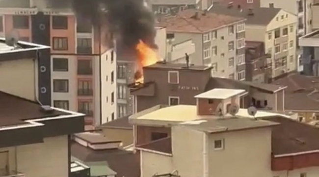 İstanbul'da bir işçi yanan çatıda sakince bekledi